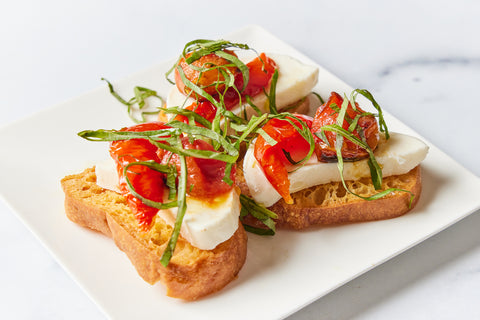 Blistered Tomato, Mozzarella & Basil Crostini